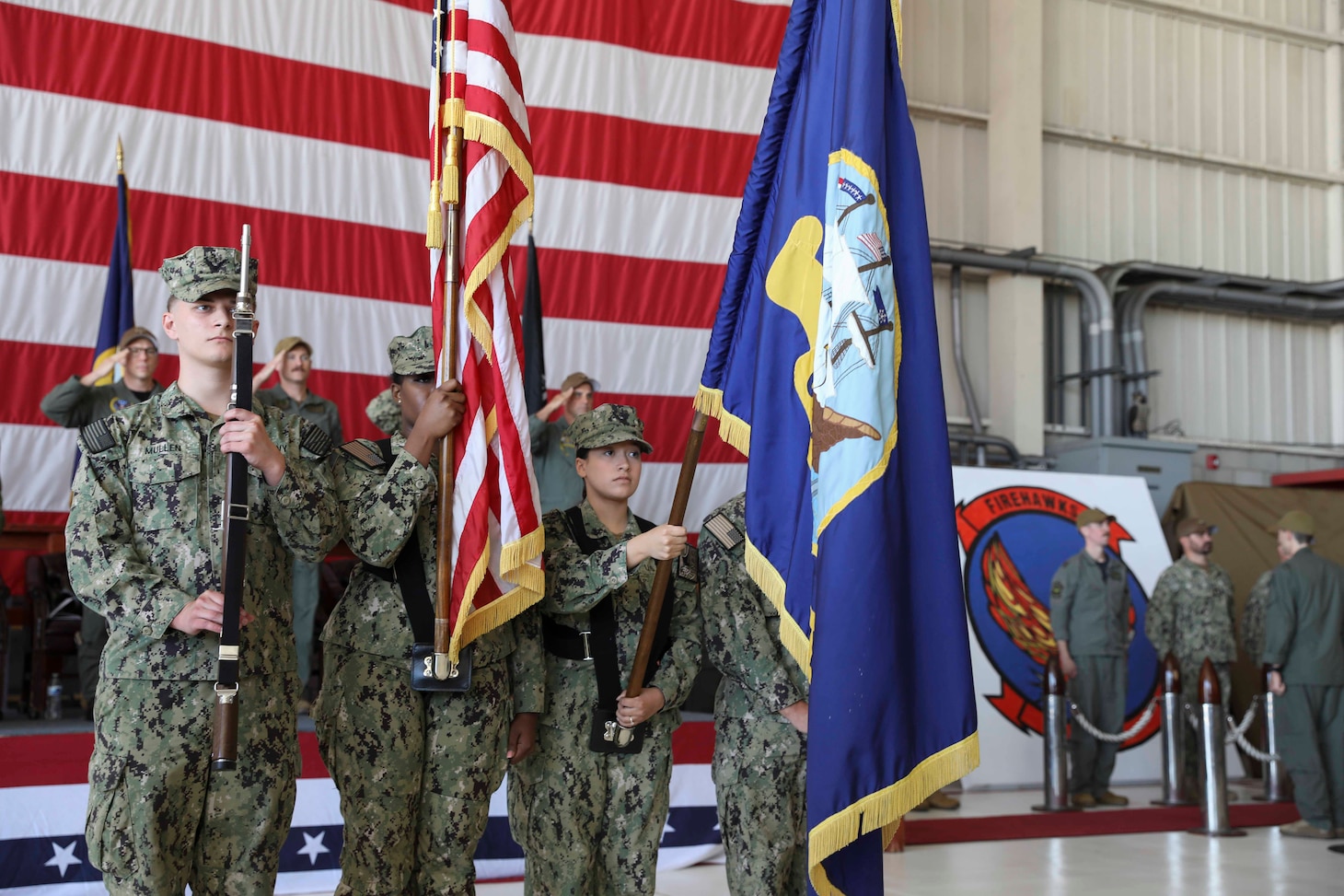 The Navy Reserve Center North Island presents the colors during the national anthem