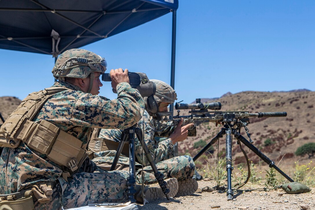 U.S. Marines with the Scout Sniper Course, Reconnaissance Training Company, Advanced Infantry Training Battalion, School of Infantry - West, fire M40A6 sniper rifles during a live-fire exercise on Range 223B on Marine Corps Base Camp Pendleton, California, July 23, 2020. The students were firing on an unknown distance range, designed to test skills of the Marines and strengthen the communication between the marksman and their observer. (U.S. Marine Corps photo by Lance Cpl. Drake Nickels)