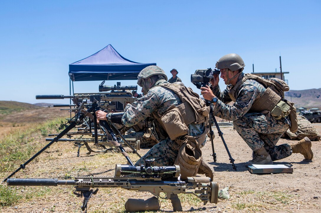 U.S. Marines with the Scout Sniper Course, Reconnaissance Training Company, Advanced Infantry Training Battalion, School of Infantry - West, fire M40A6 sniper rifles during a live-fire exercise on Range 223B on Marine Corps Base Camp Pendleton, California, July 23, 2020. The students were firing on an unknown distance range, designed to test skills of the Marines and strengthen the communication between the marksman and their observer. (U.S. Marine Corps photo by Lance Cpl. Drake Nickels)