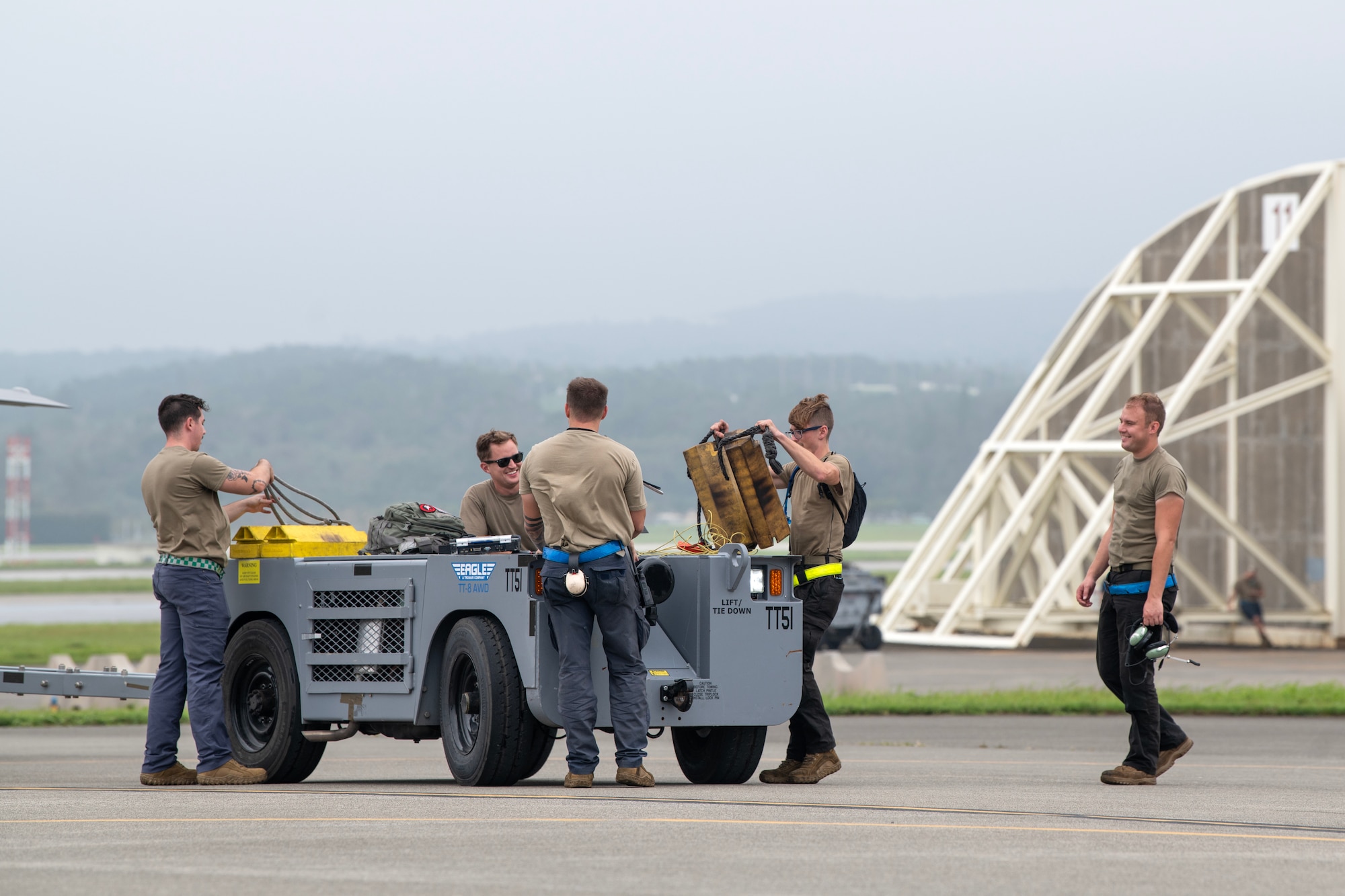 Airmen assigned to the 354th Aircraft Maintenance Squadron prepare to tow an F-35A Lightning II.