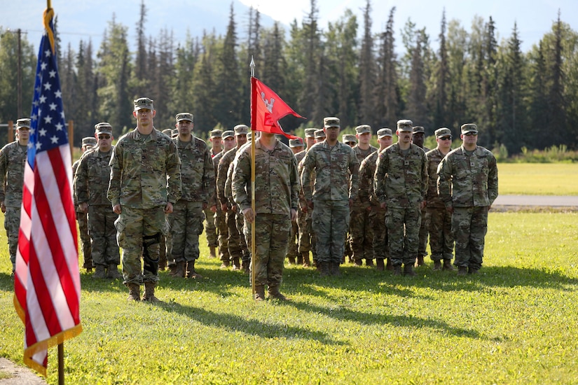 Alaska Army National Guardsmen with the 207th Engineer Utilities Detachment stand tall in formation, honoring their legacy one final time with the current colors before they are cased signifying the unit's deactivation at a ceremony at the Camp Carroll flagpole on Joint Base Elmendorf-Richardson, Alaska, Aug. 5, 2023.
