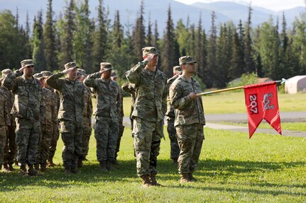 Alaska Army National Guardsmen with the 207th Engineer Utilities Detachment salute as the national anthem plays during the unit’s deactivation ceremony at the Camp Carroll flagpole on Joint Base Elmendorf-Richardson, Alaska, Aug. 5, 2023.