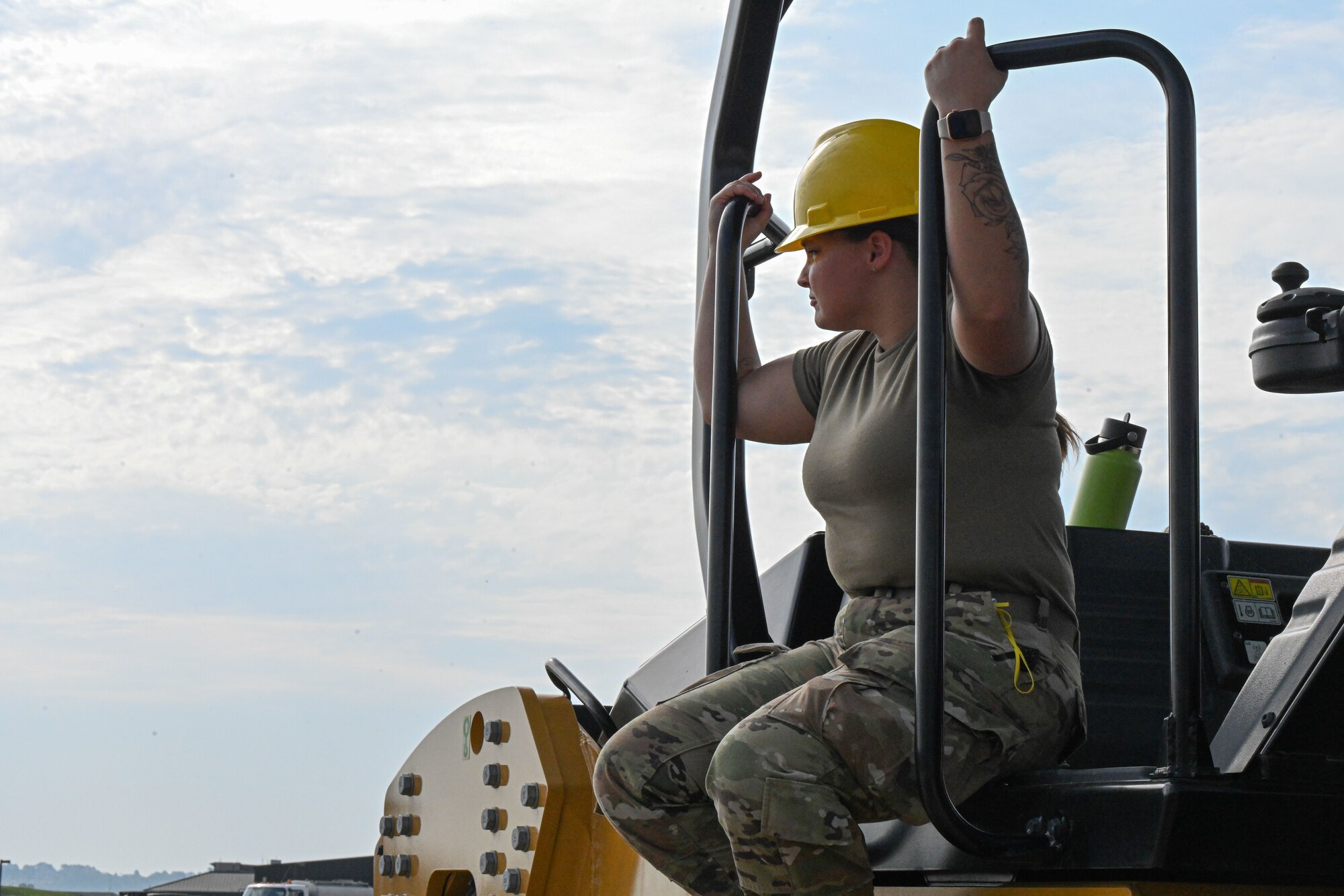 An Airman looks at a construction site.