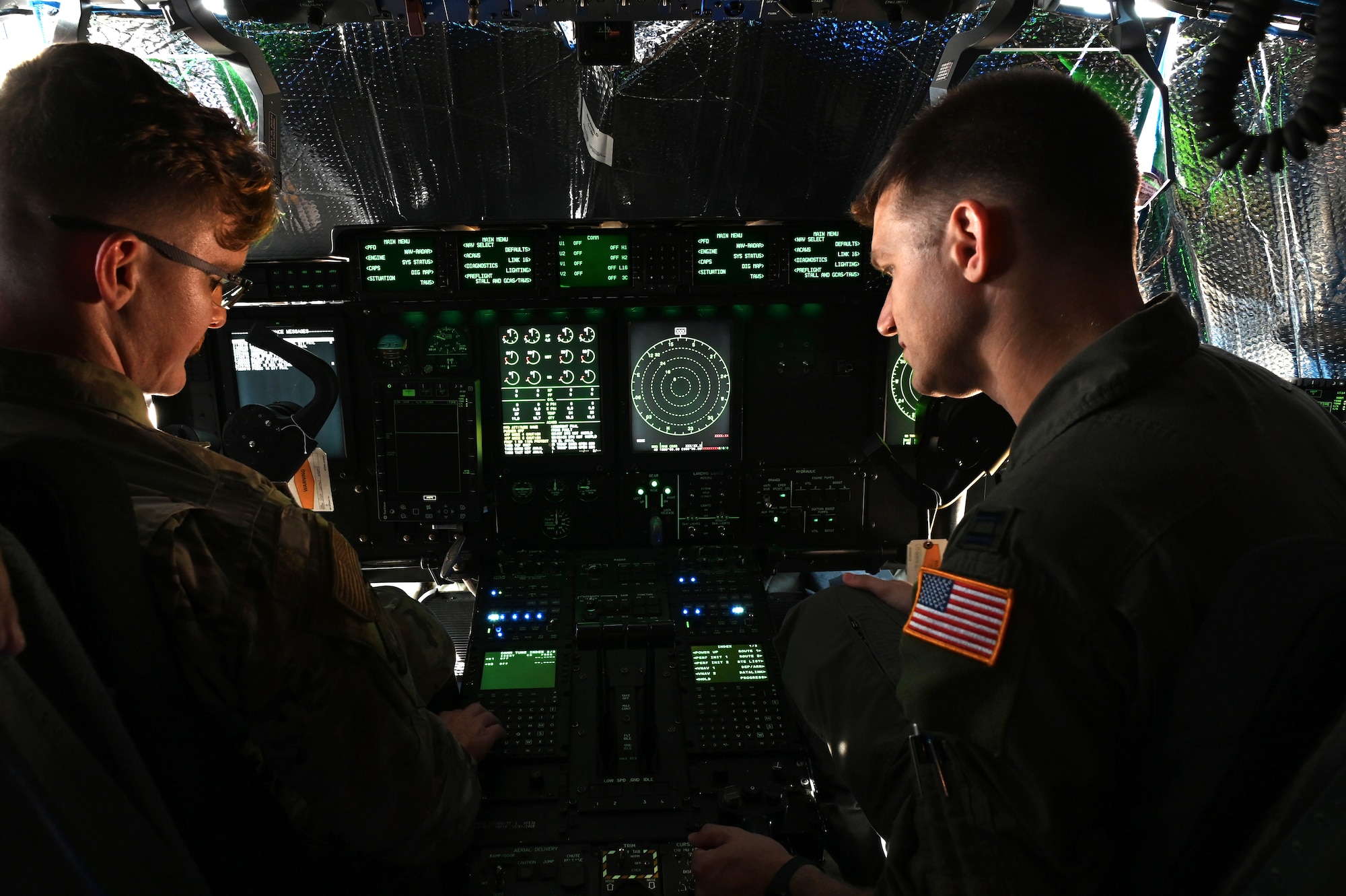 U.S. Air Force Senior Airman Benjamin Lewis, 317th Aircraft Maintenance Squadron crew chief, and Capt. Gregg Burrow, 39th Airlift Squadron assistant director of operations, explore new internal upgrades on a C-130J Super Hercules at Dyess Air Force Base, Texas, June 26, 2023. The C-130Js are undergoing Block 8.1 upgrades to help pilots, loadmasters and maintenance personnel by providing enhanced mission capabilities using modern technologies. (U.S. Air Force photo by Airman 1st Class Emma Anderson)
