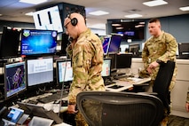 Airman looks at air picture on a monitor