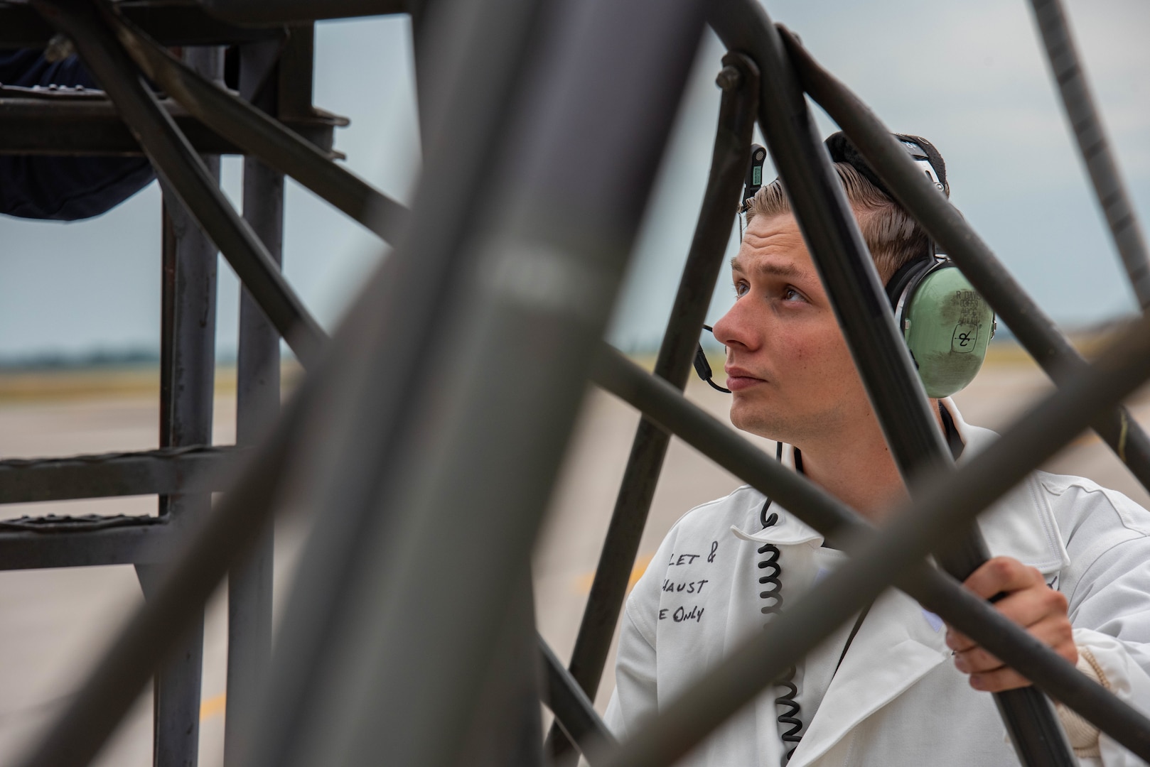 U.S. Air Force Staff Sgt. Randy Davis, 5th Aircraft Maintenance Squadron maintenance apprentice, moves a ladder during the Global Strike Challenge at Minot Air Force Base, North Dakota, Aug. 4, 2023. Davis performed a series of maintenance checks on a B-52H Stratofortress while competing in the Global Strike Challenge. (U.S. Air Force photo by Airman 1st Class Kyle Wilson)