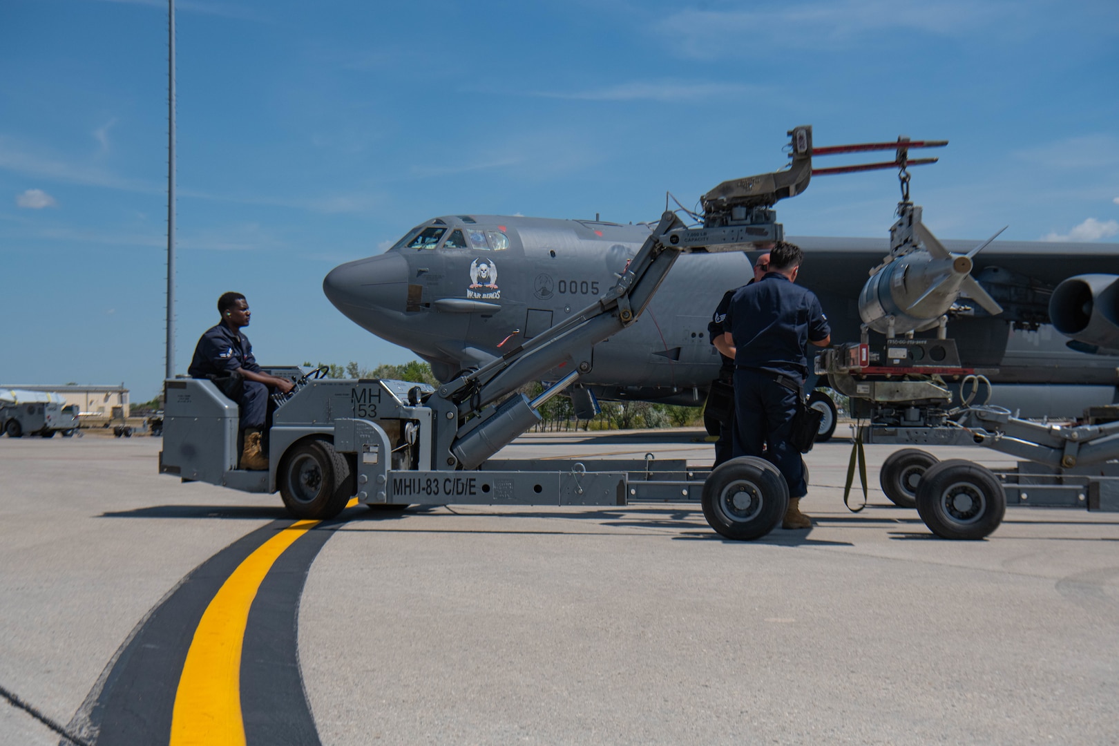 Airmen, assigned to the 5th Aircraft Maintenance Squadron, compete in the Global Strike Challenge at Minot Air Force Base, North Dakota, Aug. 3, 2023. The Global Strike Challenge tested weapons load crews’ ability to load weapons systems onto a B-52H Stratofortress as safely, quickly, and efficiently as possible. (U.S. Air Force photo by Airman 1st Class Kyle Wilson)