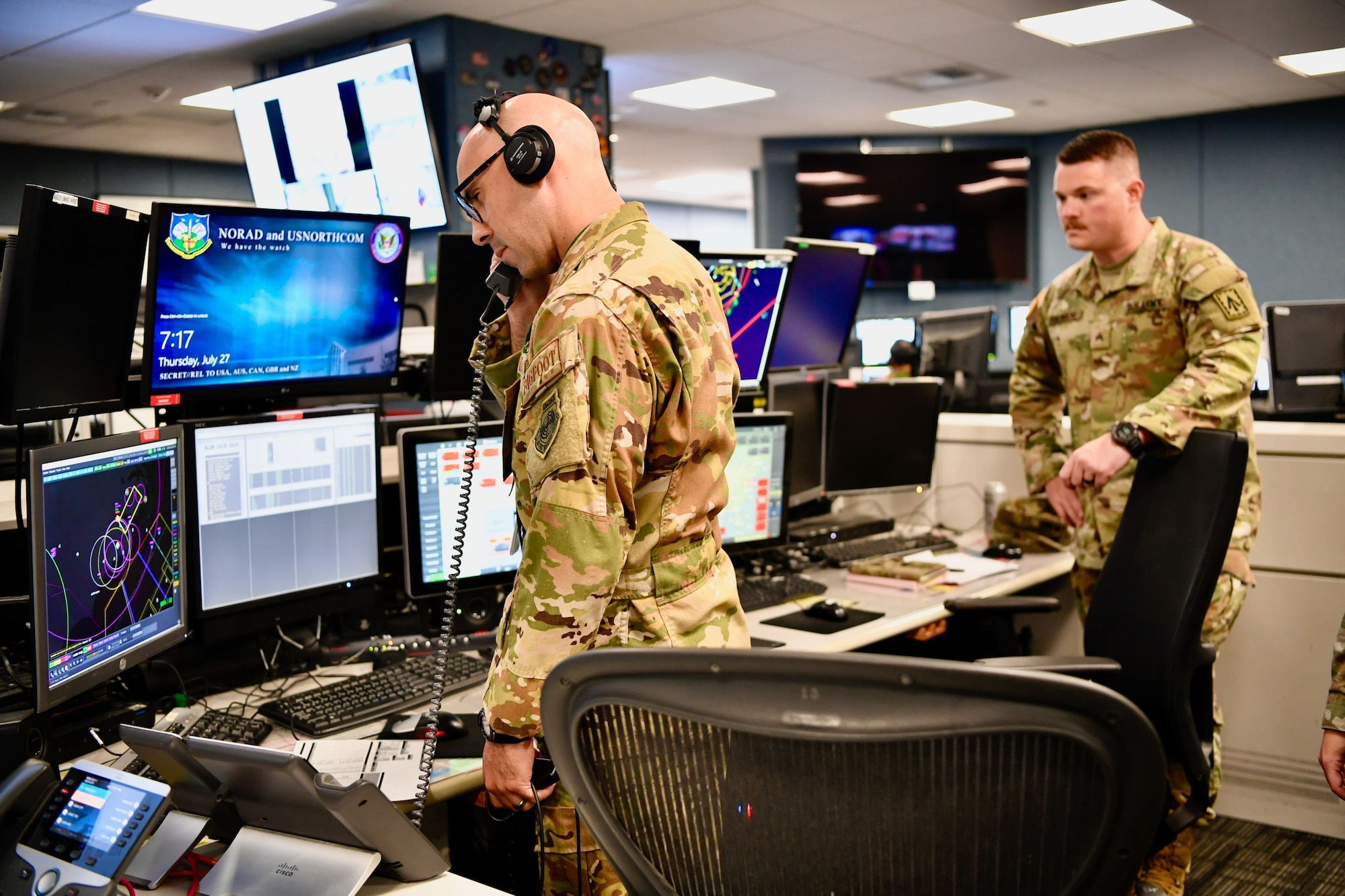 Airman looks at air picture on a monitor