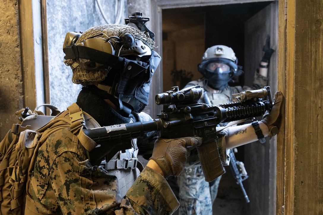 U.S. Marines with Advanced Infantry Training Battalion, School of Infantry-West, Hawaii Detachment, await further instructions during urban operations training, Marine Corps Training Area Bellows, July 11, 2023. The training was conducted as part of the Advanced Infantry Marine Course. AIMC is designed to enhance and test Marines’ skills with a focus on reinforcing proper patrols and operational procedures. (U.S. Marine Corps photo by Cpl. Chandler Stacy)