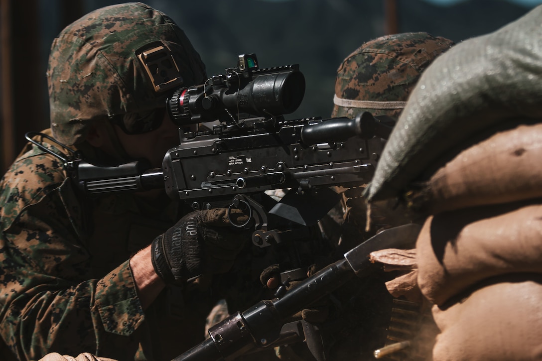 A U.S. Marine with the Advanced Machine Gun course fires a M240G medium machine gun during a live-fire exercise at Range 218 on Marine Corps Base Camp Pendleton, California, Feb. 16, 2022. AMGC is a six-week course where machine gunners advance their warfighting and weaponry skills, as well as their land navigation and small unit leadership. (U.S. Marine Corps photo by Lance Cpl. Shaina Jupiter)