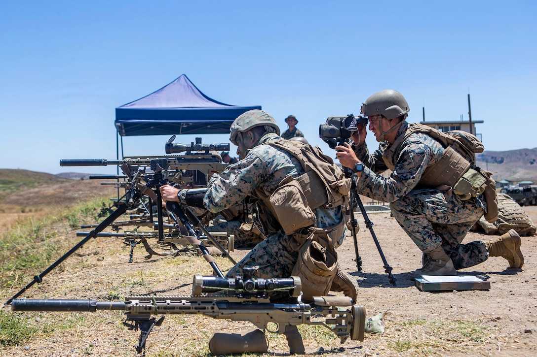 U.S. Marines with the Scout Sniper Course, Reconnaissance Training Company, Advanced Infantry Training Battalion, School of Infantry - West, fire M40A6 sniper rifles during a live-fire exercise on Range 223B on Marine Corps Base Camp Pendleton, California, July 23, 2020. The students were firing on an unknown distance range, designed to test skills of the Marines and strengthen the communication between the marksman and their observer. (U.S. Marine Corps photo by Lance Cpl. Drake Nickels)