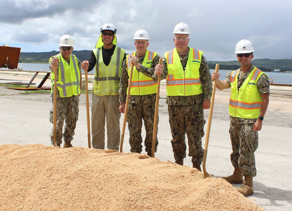 NAVAL BASE GUAM  (Aug. 9, 2023) - Joint Region Marianas Chief-of-Staff Capt. Michael Smith, U.S. Naval Base (NBG) Commanding Officer Capt. Michael Luckett, Naval Facilities Engineering Systems Command (NAVFAC) Marianas Commanding Officer Capt. Troy Brown, NAVFAC Marianas Facilities Engineering and Acquisition Division (FEAD) Director Lt. Cmdr. Ryan Sawyer, and Senior Project Manager Chuck Lowther broke ground at the site of the Mike and November wharves, onboard NBG Aug. 8. 

Pictured from left to right: Luckett, Lowther, Smith, Brown, and Sawyer. NAVFAC Marianas awarded a $138 million firm-fixed-price contract to H2O Guam, JV, Aiea, Hawaii to repair the wharves.