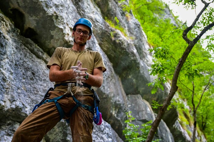 U.S. Air Force Senior Airman Sean Carey, 31st Maintenance group aerospace ground equipment journeyman, poses for a photo before rock-climbing.