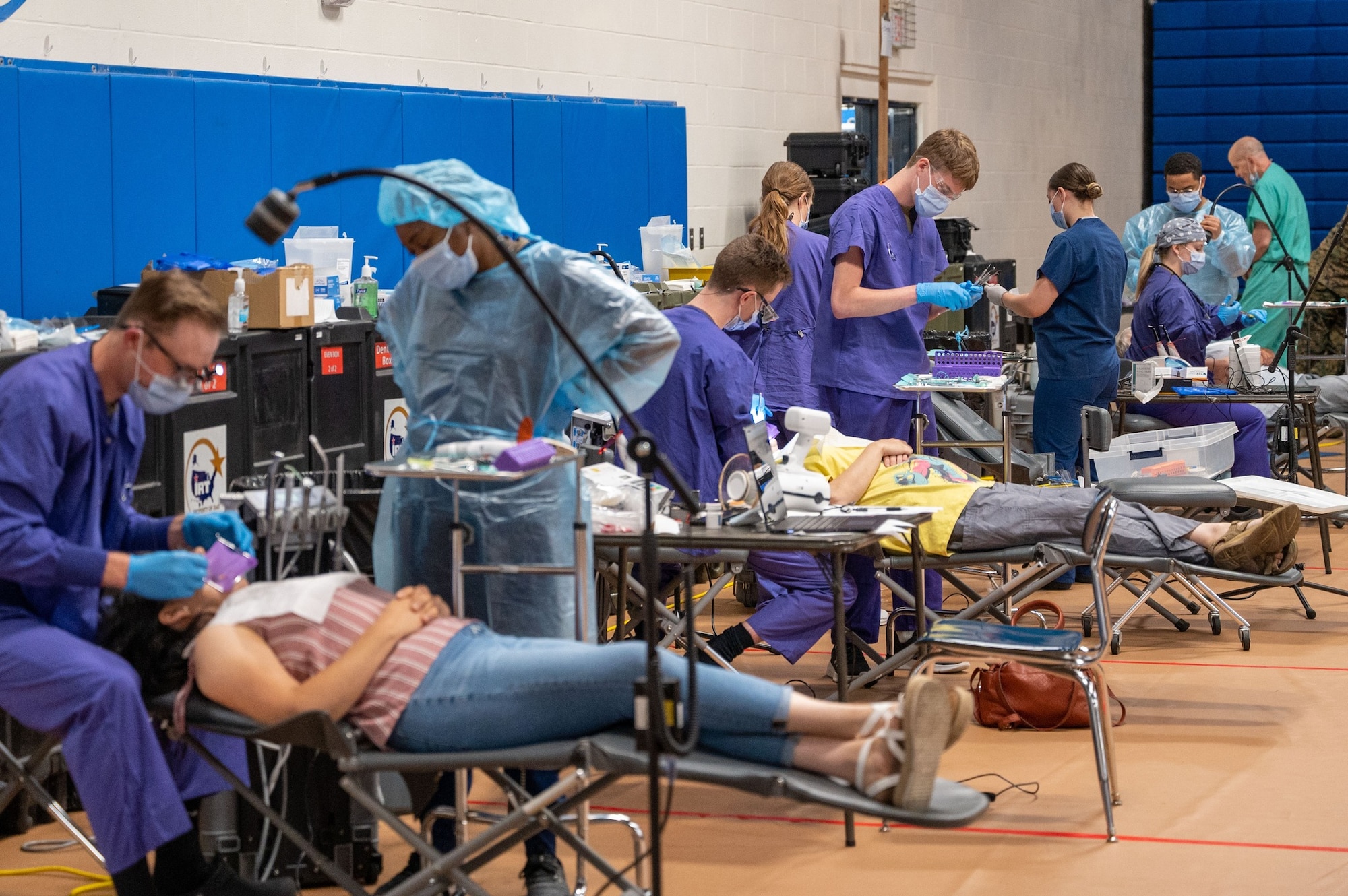 U.S. Air Force Army, and Navy Reserve dentists and dental technicians provide services to patients during Innovative Readiness Training's Healthy Tennesseans event at Bledsoe County High School in Pikeville, Tenn., June 4, 2023.