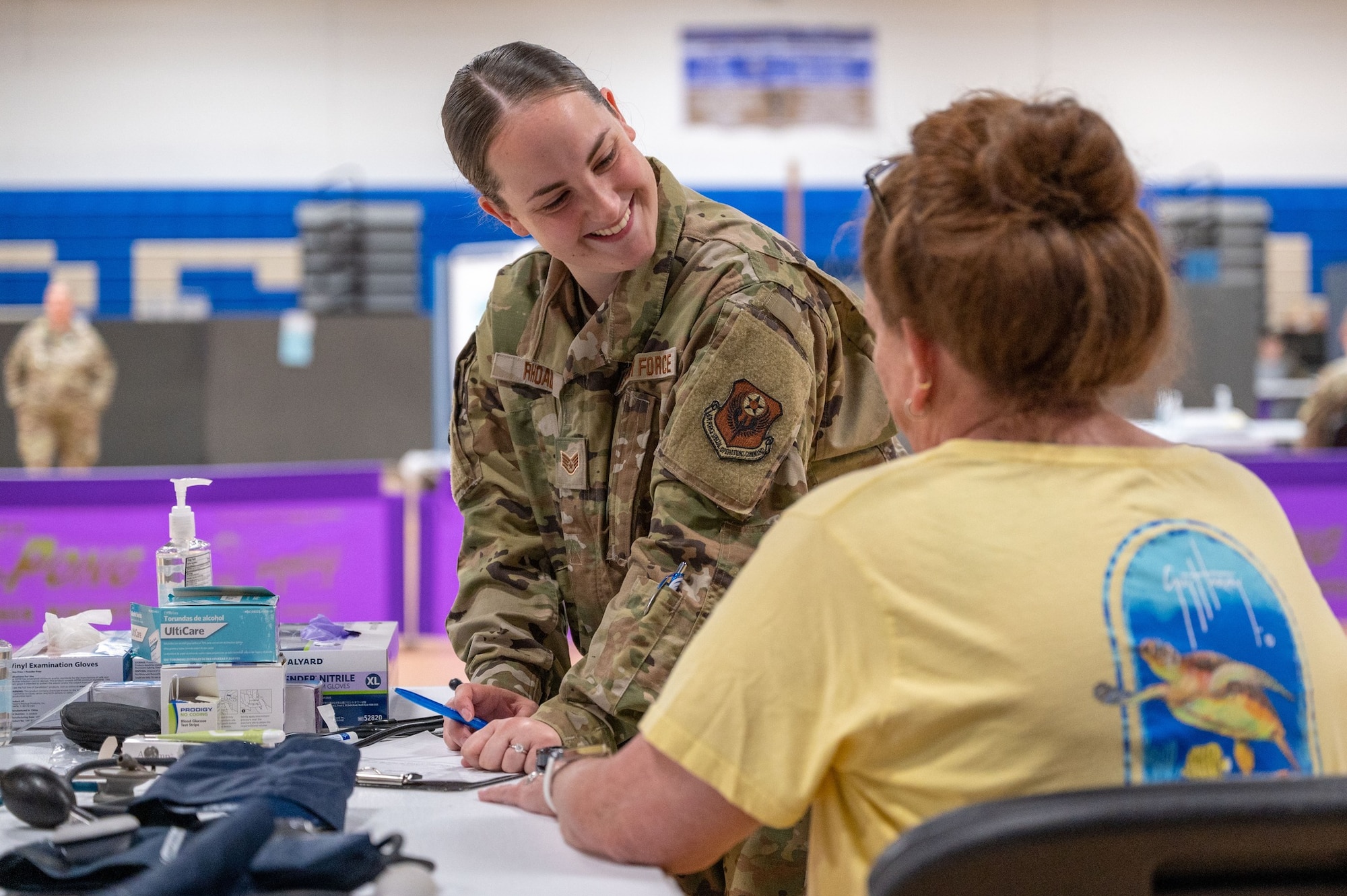 Staff Sgt. Kayla Rhoads, 193rd Special Operations Medical Group medic, records a patient's information during Innovative Readiness Training's Healthy Tennesseans event at Bledsoe County High School in Pikeville, Tenn., June 4, 2023.