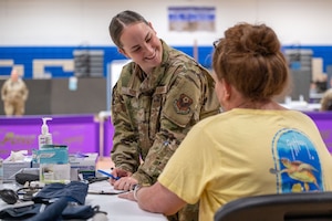 Staff Sgt. Kayla Rhoads, 193rd Special Operations Medical Group medic, records a patient's information during Innovative Readiness Training's Healthy Tennesseans event at Bledsoe County High School in Pikeville, Tenn., June 4, 2023.