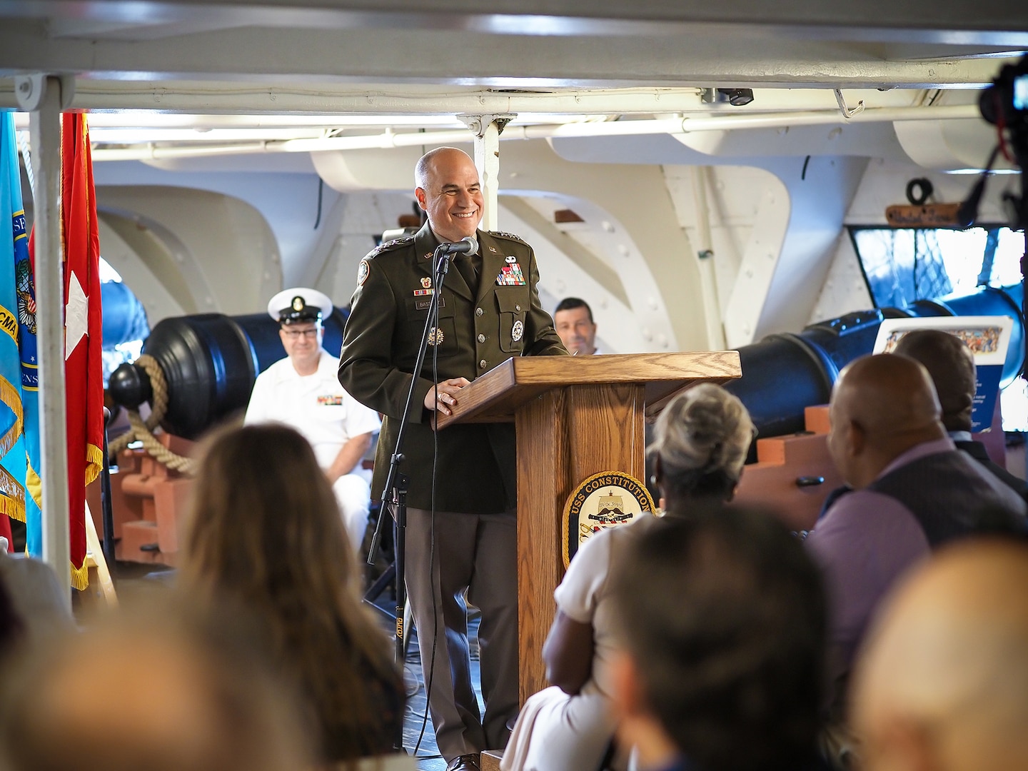 An Army officer speaks from a podium