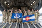 Airmen from the 138th Space Control Squadron, Peterson Air Force Base, Colorado Air National Guard, prepare to depart from Peterson Air Force Base to Washington, D.C., via an F-18 Globemaster courtesy of the 183rd Airlift Squadron, Mississippi Air National Guard, May 11, 2023.