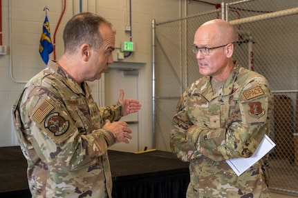 U.S. Air Force Maj. Gen. Edward Vaughan, director of space operations for the National Guard, speaks with Brig. Gen. Michael Bruno, chief of joint staff for the Colorado Air National Guard, on Peterson Space Force Base, Colorado Springs, Colo., Aug. 5, 2023. The Colorado National Guard’s 138th Electromagnetic Warfare Squadron hosted a ribbon-cutting ceremony to mark the opening of its new facility at Peterson Space Force Base.