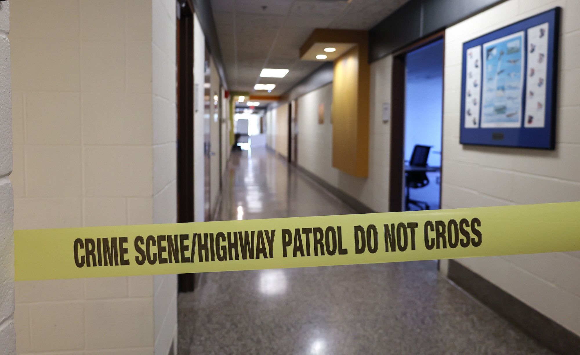 Crime scene tape adds to an active shooter scenario during training at Calamityville, Fairborn, Ohio, July 14, 2023. Airmen with the 445th Airlift Wing, alongside civilian law enforcement, learned how to properly respond to active shooter scenes during the training that is held once a year, as well as critical care. (U.S. Air Force photo by Amanda Dick)