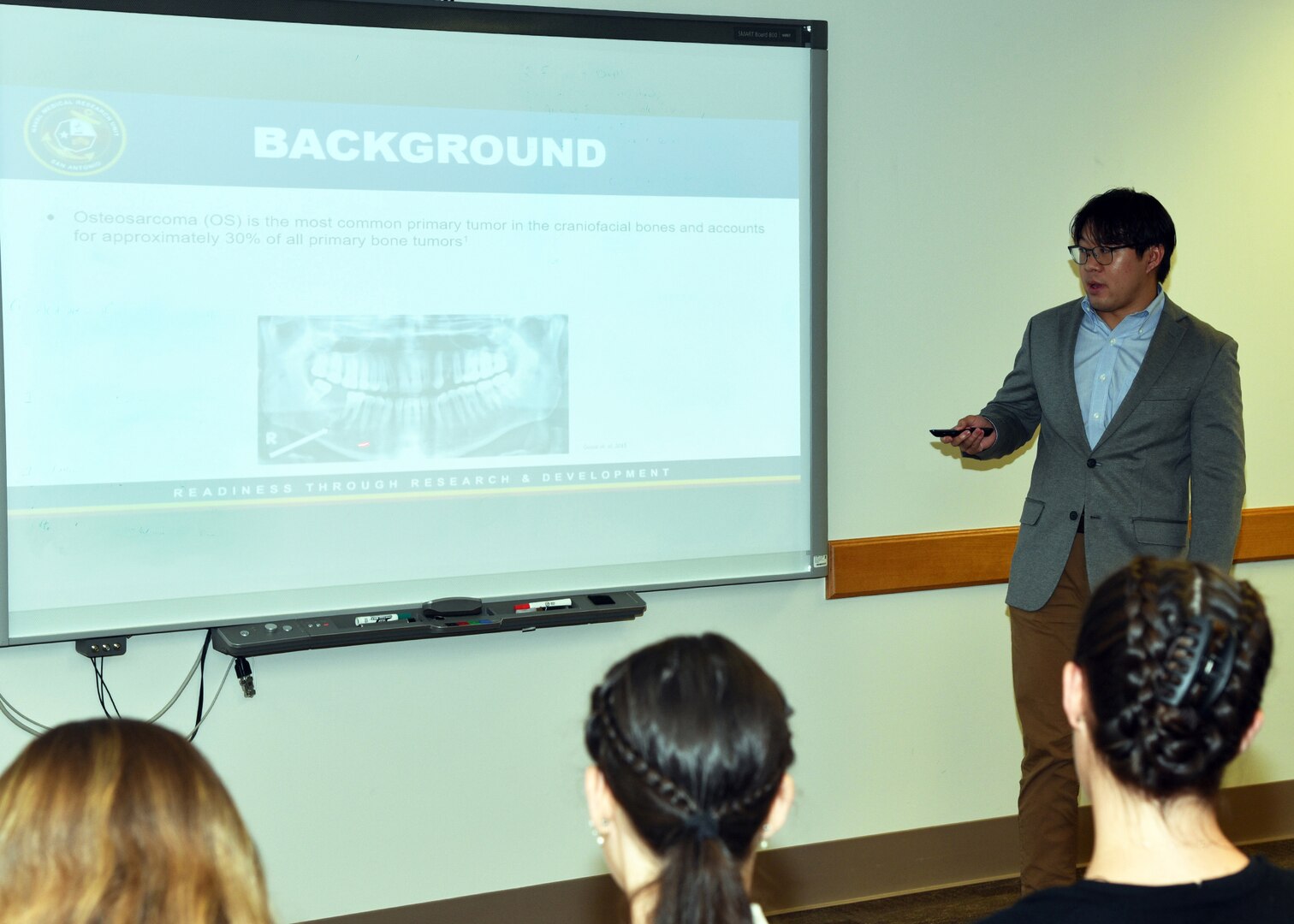 JOINT BASE SAN ANTONO-FORT SAM HOUSTON – (Aug. 2, 2023) – Cornell University senior Tristan Tran, of Long Island, N.Y., an intern assigned to Naval Medical Research Unit (NAMRU) San Antonio, delivers his briefing titled “Analysis of the MDM2-p53 Relationship in 12q Amplicon-driven Osteosarcomas” to his mentor, Cmdr. Rachel Werner, NAMRU San Antonio leadership and other researchers as part of the Office of Naval Research’s Naval Research Enterprise Internship Program (NREIP) at the Battlefield Health and Trauma Research Institute. NREIP places college and university students in the Department of the Navy laboratories where they take part in real Naval research for ten weeks during the summer. NREIP gives academically talented college students, graduating seniors, and graduate students pursuing STEM careers the opportunity to learn about Naval research and technology while receiving first-class mentoring by top scientists and engineers. NAMRU San Antonio is one of the leading research and development laboratories for the U.S. Navy under the Department of Defense (DoD) and is one of eight subordinate research commands in the global network of laboratories operating under the Naval Medical Research Command in Silver Spring, Md.  Its mission is to conduct gap driven combat casualty care, craniofacial, and directed energy research to improve survival, operational readiness, and safety of DoD personnel engaged in routine and expeditionary operations. (U.S. Navy photo by Burrell Parmer, NAMRU San Antonio Public Affairs/Released)