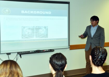 JOINT BASE SAN ANTONO-FORT SAM HOUSTON – (Aug. 2, 2023) – Cornell University senior Tristan Tran, of Long Island, N.Y., an intern assigned to Naval Medical Research Unit (NAMRU) San Antonio, delivers his briefing titled “Analysis of the MDM2-p53 Relationship in 12q Amplicon-driven Osteosarcomas” to his mentor, Cmdr. Rachel Werner, NAMRU San Antonio leadership and other researchers as part of the Office of Naval Research’s Naval Research Enterprise Internship Program (NREIP) at the Battlefield Health and Trauma Research Institute. NREIP places college and university students in the Department of the Navy laboratories where they take part in real Naval research for ten weeks during the summer. NREIP gives academically talented college students, graduating seniors, and graduate students pursuing STEM careers the opportunity to learn about Naval research and technology while receiving first-class mentoring by top scientists and engineers. NAMRU San Antonio is one of the leading research and development laboratories for the U.S. Navy under the Department of Defense (DoD) and is one of eight subordinate research commands in the global network of laboratories operating under the Naval Medical Research Command in Silver Spring, Md.  Its mission is to conduct gap driven combat casualty care, craniofacial, and directed energy research to improve survival, operational readiness, and safety of DoD personnel engaged in routine and expeditionary operations. (U.S. Navy photo by Burrell Parmer, NAMRU San Antonio Public Affairs/Released)