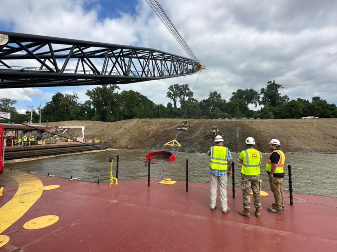 Memphis District Commander Col. Brian Sawser and several members of the district leadership team traveled to Mhoon Bend, Mississippi, on July 12, to visit the district's Bank Grading Unit team and observe the new bank grader, Grader 1, in action for the first time since its arrival and christening earlier this year. 

With this year’s revetment season now in full swing, the BGU is laser-focused on accomplishing two key objectives, with the first being training, both contractor-led and on-the-job, to attain the necessary certifications and practice according to each employees' role. 

Additionally, unit operators will use this first test site to calibrate the newly constructed machine, ensuring it's “put through the paces,” so to speak.



Additionally, unit operators will use this first test site to calibrate the newly constructed machine, ensuring it's “put through the paces,” so to speak.