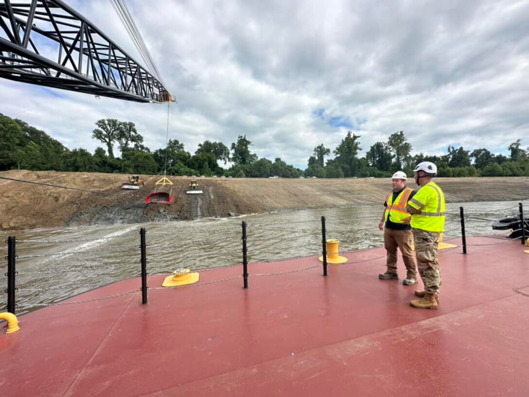 Memphis District Commander Col. Brian Sawser and several members of the district leadership team traveled to Mhoon Bend, Mississippi, on July 12, to visit the district's Bank Grading Unit team and observe the new bank grader, Grader 1, in action for the first time since its arrival and christening earlier this year. 

With this year’s revetment season now in full swing, the BGU is laser-focused on accomplishing two key objectives, with the first being training, both contractor-led and on-the-job, to attain the necessary certifications and practice according to each employees' role. 

Additionally, unit operators will use this first test site to calibrate the newly constructed machine, ensuring it's “put through the paces,” so to speak.



Additionally, unit operators will use this first test site to calibrate the newly constructed machine, ensuring it's “put through the paces,” so to speak.