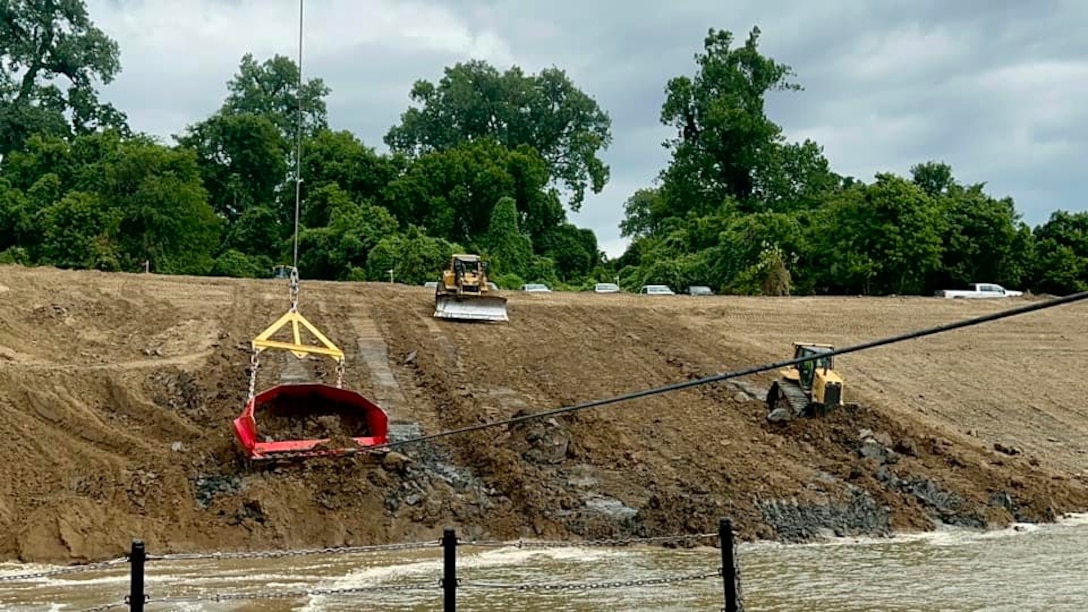 Memphis District Commander Col. Brian Sawser and several members of the district leadership team traveled to Mhoon Bend, Mississippi, on July 12, to visit the district's Bank Grading Unit team and observe the new bank grader, Grader 1, in action for the first time since its arrival and christening earlier this year. 

With this year’s revetment season now in full swing, the BGU is laser-focused on accomplishing two key objectives, with the first being training, both contractor-led and on-the-job, to attain the necessary certifications and practice according to each employees' role. 

Additionally, unit operators will use this first test site to calibrate the newly constructed machine, ensuring it's “put through the paces,” so to speak.



Additionally, unit operators will use this first test site to calibrate the newly constructed machine, ensuring it's “put through the paces,” so to speak.