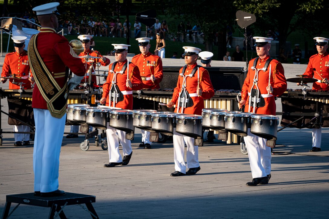 Marines with “The Commandant’s Own,” U.S. Marine Drum & Bugle Corps, Marine Barracks Washington, perform during a Tuesday Sunset Parade at the Lincoln Memorial, Washington, D.C., July 11, 2023. The hosting official was Lieutenant General Edward Banta, Deputy Commandant, Installations and Logistics, and the guest of honor was The Honorable Meredith Berger, Assistant Secretary of the Navy (Energy, Installations, and Environment)/Chief Sustainability Officer. (U.S. Marine Corps photo by Cpl. Mark A. Morales)