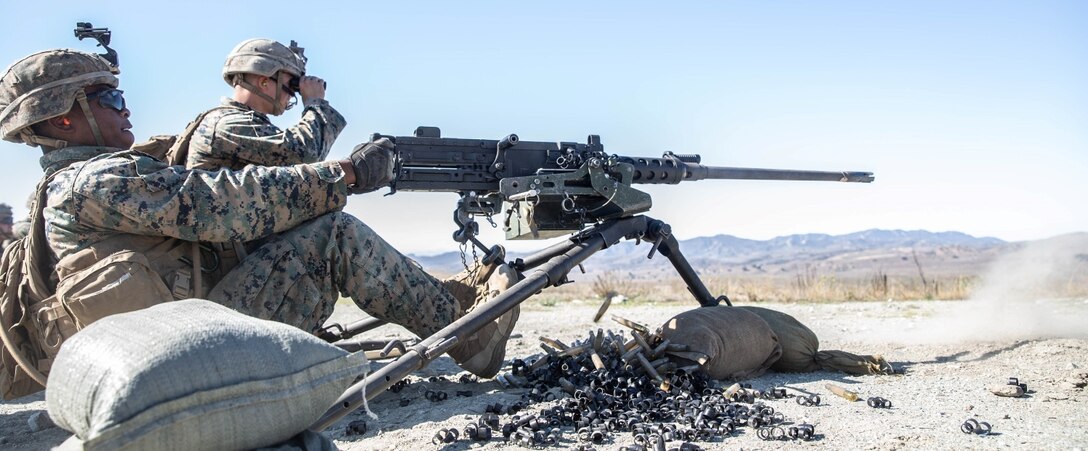 U.S. Marine Corps Cpl. Jamaury M. Jimenez, a machine gunner with Advanced Machine Gun Course (AMGC) 1-22, fires polymer rounds from a .50-caliber machine gun at Marine Corps Base Camp Pendleton, California, Nov. 3, 2021. During the course of fire, Marines tested polymer-cased ammunition that reduces the weight of a 100-round linked belt of .50-caliber ammunition by seven pounds, reducing the weight Marines have to transport. (U.S. Marine Corps photo by Cpl. Cameron Hermanet)