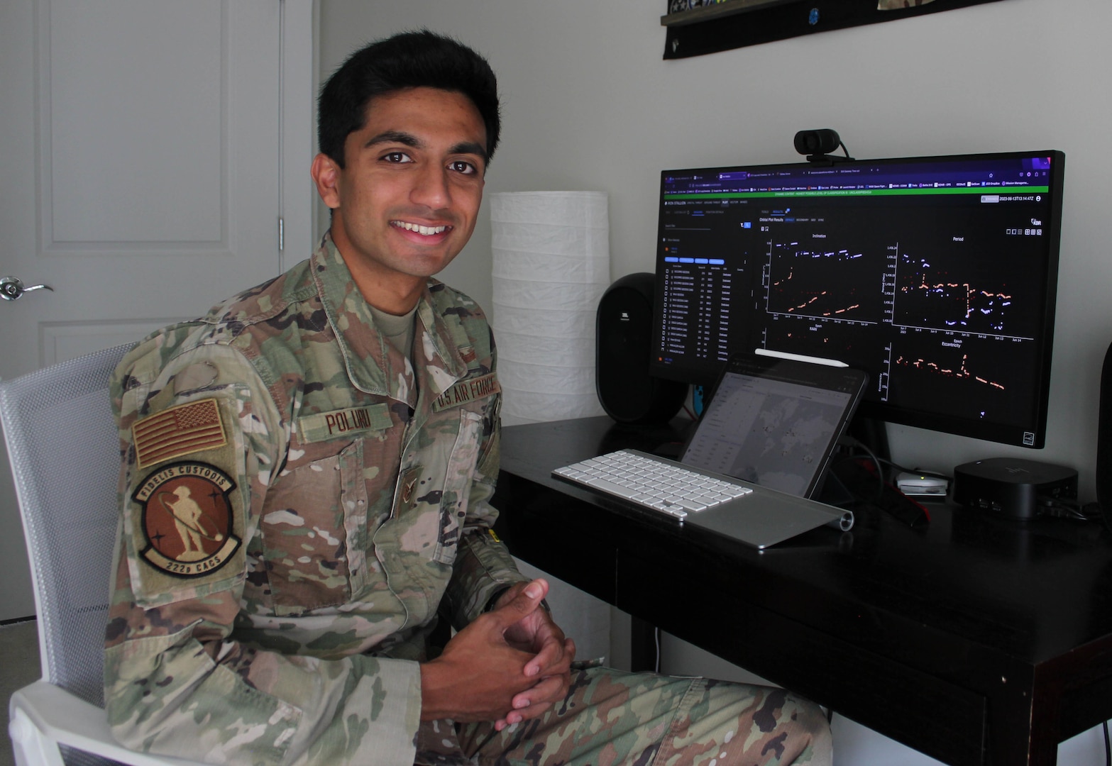 New York Air National Guard Staff Sgt.  Dhruva Poluru, a member of the 107th Attack Wing's 222nd Command and Control Squadron, seen here at his home office in Chantilly, Va., on June 12, 2023, is one of 12 Airmen of the Year for the 500,000-member total Air Force.  Poluru serves as a full-time Guardsman assigned to the National Reconnaissance Office.