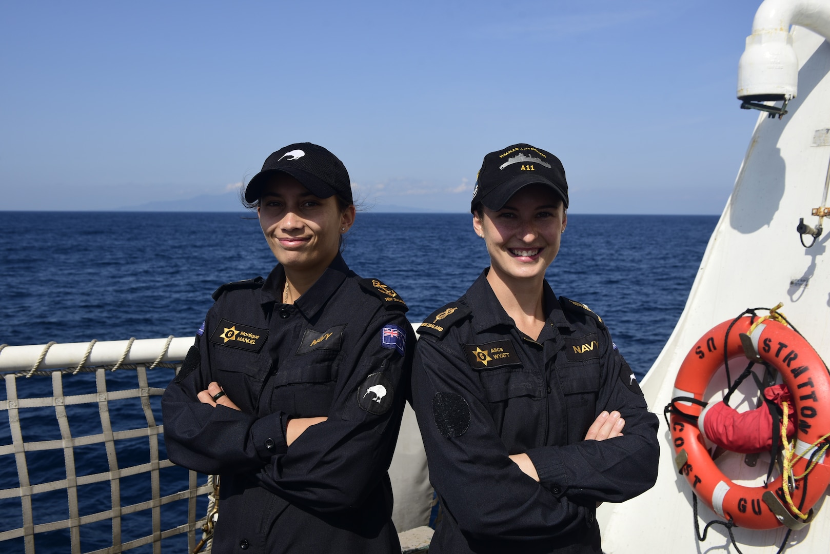Lead Able Chef Monique Manuel and Able Chef Alice Wyatt, Royal New Zealand Navy Sailors, begin a deployment aboard U.S. Coast Guard Cutter Stratton (WMSL 752) May 26, 2023, in the South China Sea. Stratton deployed to the Western Pacific to conduct engagements with regional allies and partner nations, reinforcing a rules-based order in the maritime domain. (U.S. Coast Guard Petty Officer 2nd Class Michael Clark)