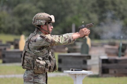 Spc. Jason Riley fires his weapon during a marksmanship drill at Army Materiel Command's 2023 Best Squad Competition at Fort Novosel, Alabama. (Alyssa Crockett)