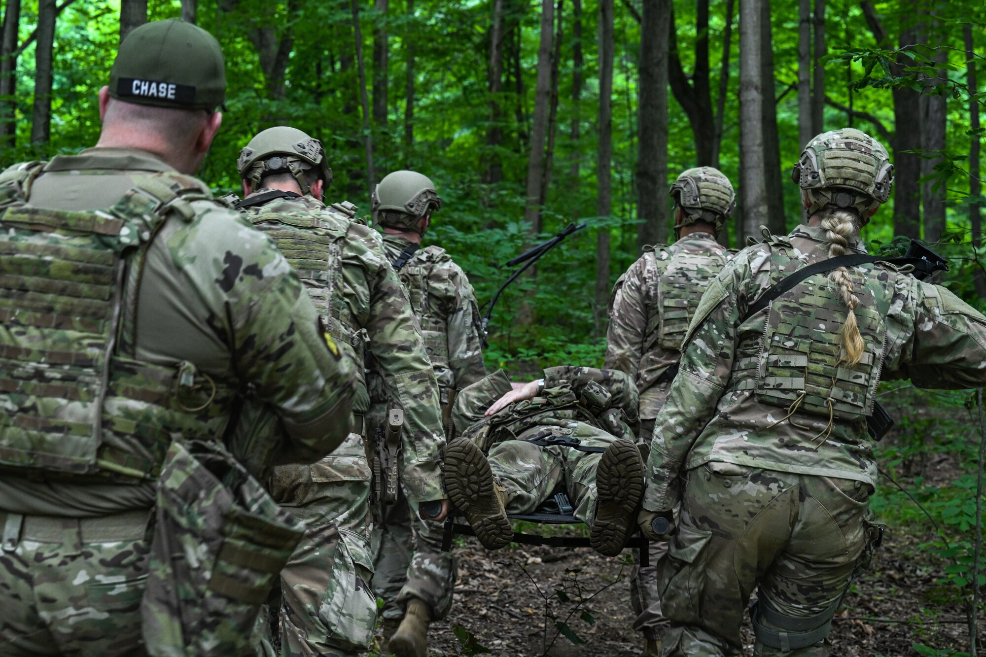 Senior Master Sgt. Daniel Chase, Integrated Defense Leadership Course chief assigned to the 310th Security Forces Squadron, Schriever Space Force Base, Colorado, observes students during a tactical combat casualty care training exercise on July 24, 2023, at Camp James A. Garfield Joint Military Training Center, Ohio.