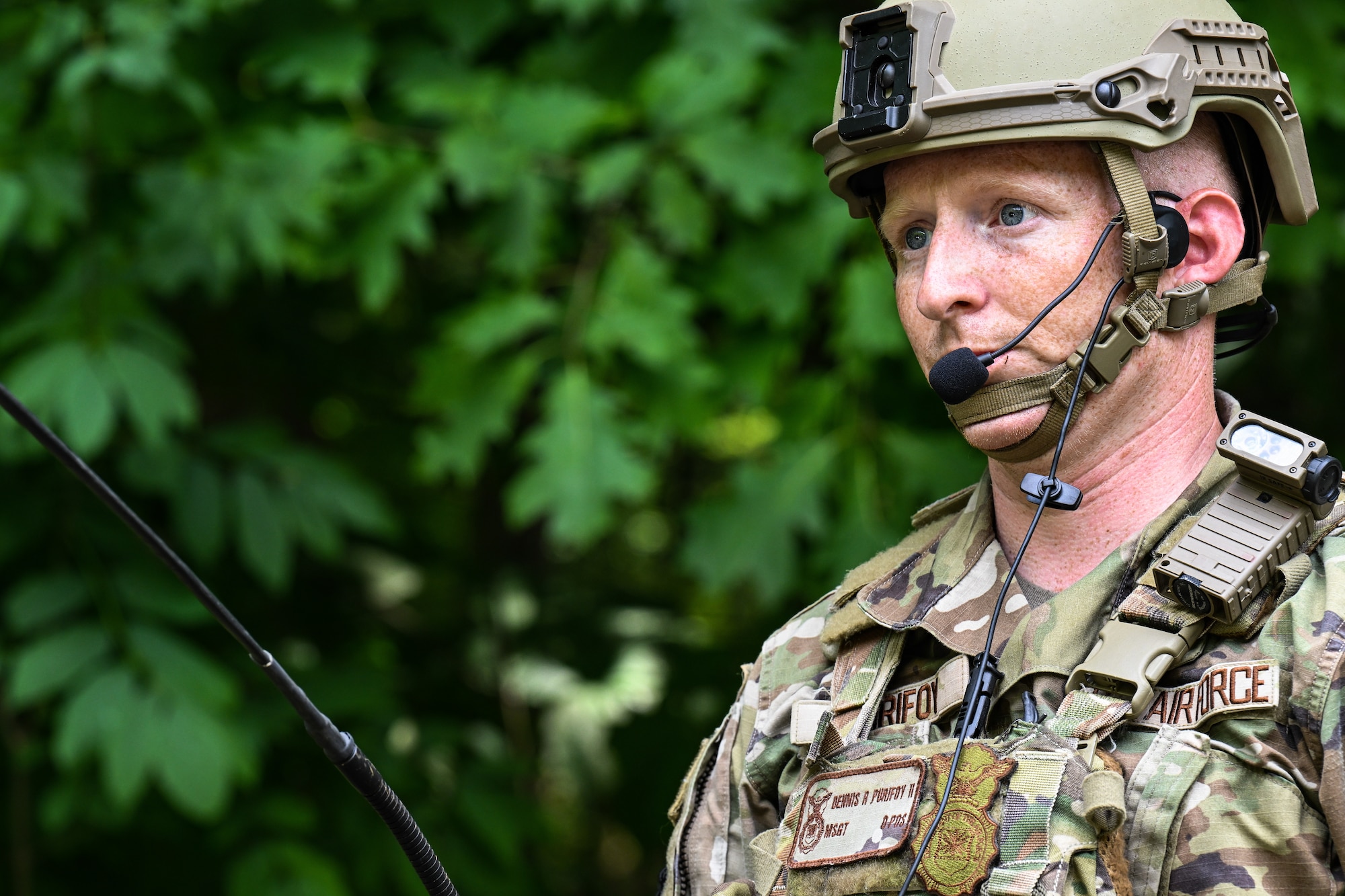 Master Sgt. Dennis Purifoy, a Defender assigned to the North Carolina Air National Guard’s 145th Security Forces Squadron, simulates communicating a nine-line medevac request during an Integrated Defense Leadership Course training exercise on July 24, 2023, at Camp James A. Garfield Joint Military Training Center, Ohio.