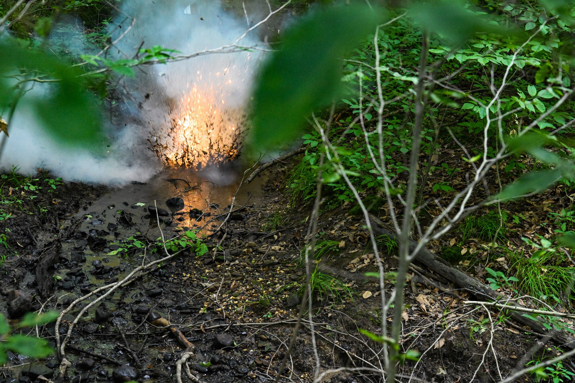 A grenade simulator detonates during an Integrated Defense Leadership Course static defense training exercise on July 24, 2023, at Camp James A. Garfield Joint Military Training Center, Ohio.