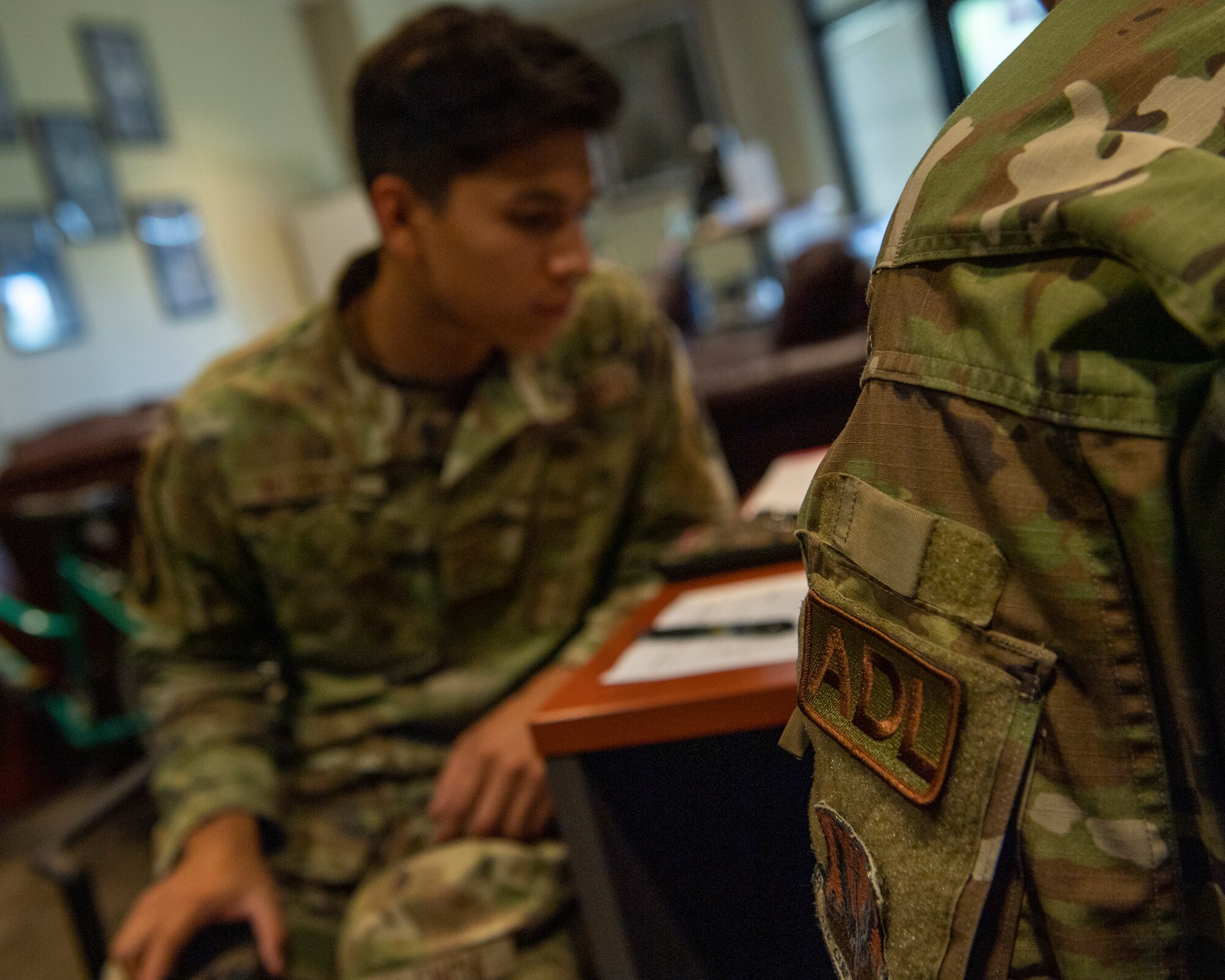 U.S. Air Force Senior Airman Jairo Valencia, 71st Rescue Generation Squadron aircraft electrical and environmental systems technician, looks over out-processing paperwork with U.S. Air Force Staff Sgt. Chris Goble, 23rd Civil Engineer Squadron Airman dorm leader, at Moody Air Force Base, Georgia, July 11, 2023. Airmen can rely on ADLs to help resolve dormitory issues, such as maintenance problems or roommate conflicts. (U.S. Air Force photo by Airman 1st Class Leonid Soubbotine)