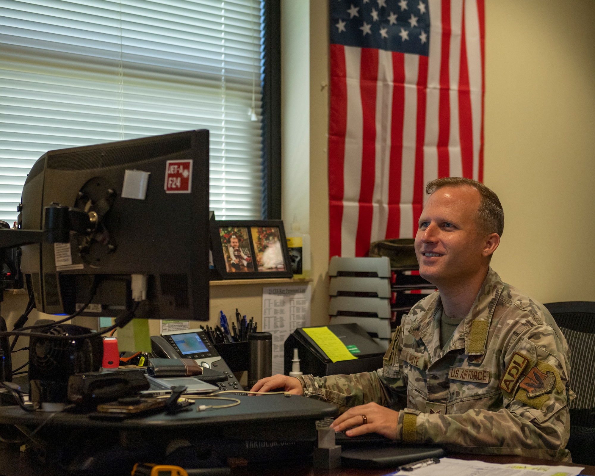 U.S. Air Force Tech. Sgt. Bryan White, 23rd Civil Engineer Squadron dorm management noncommissioned officer in charge, works from his computer at Moody Air Force Base, Georgia, July 11, 2023. Airman dorm leaders not only manage several dorm buildings, but also provide mentorship, guidance and support to new Airmen. (U.S. Air Force photo by Airman 1st Class Leonid Soubbotine)