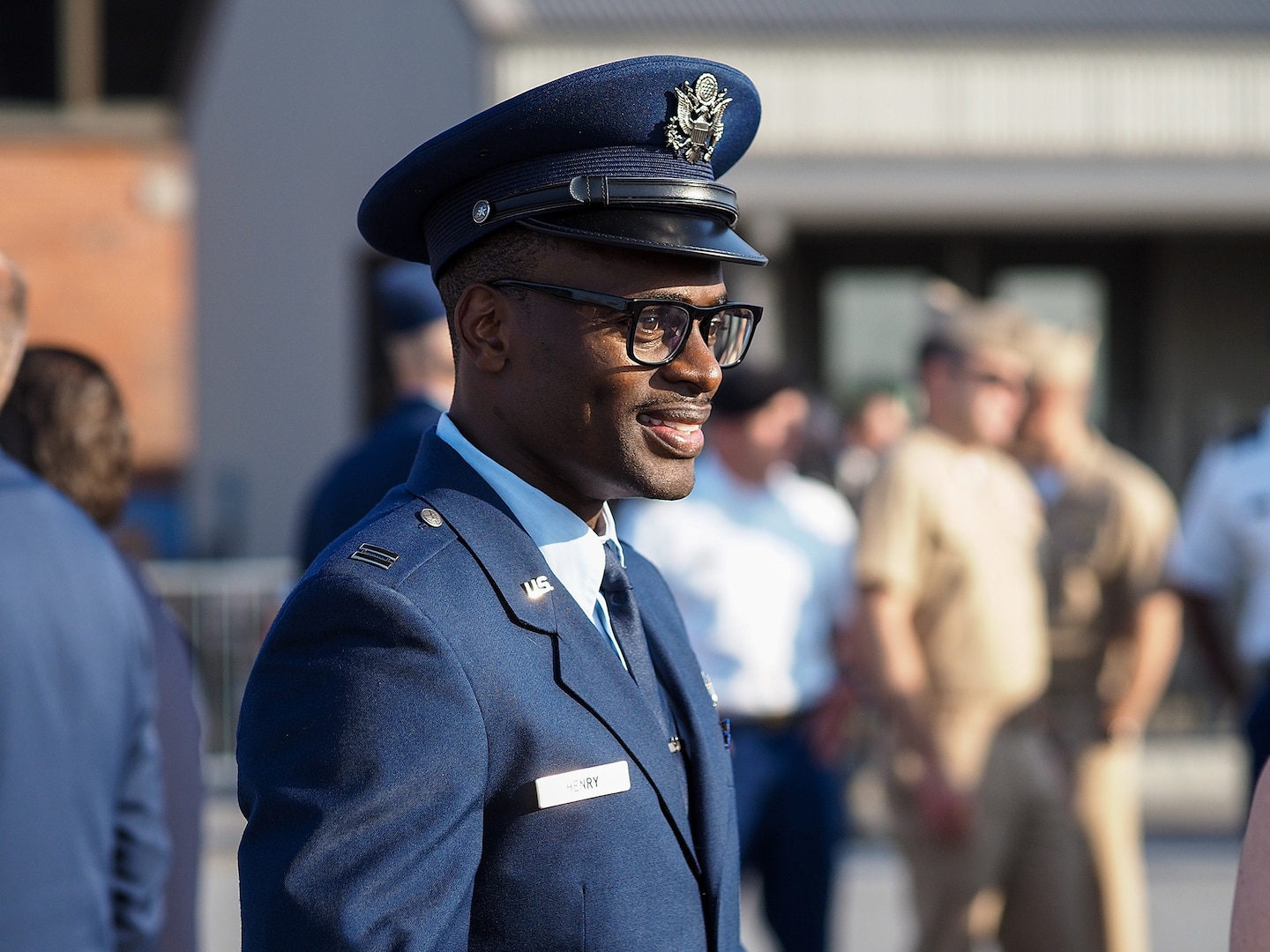 A man in a blue uniform and cap.
