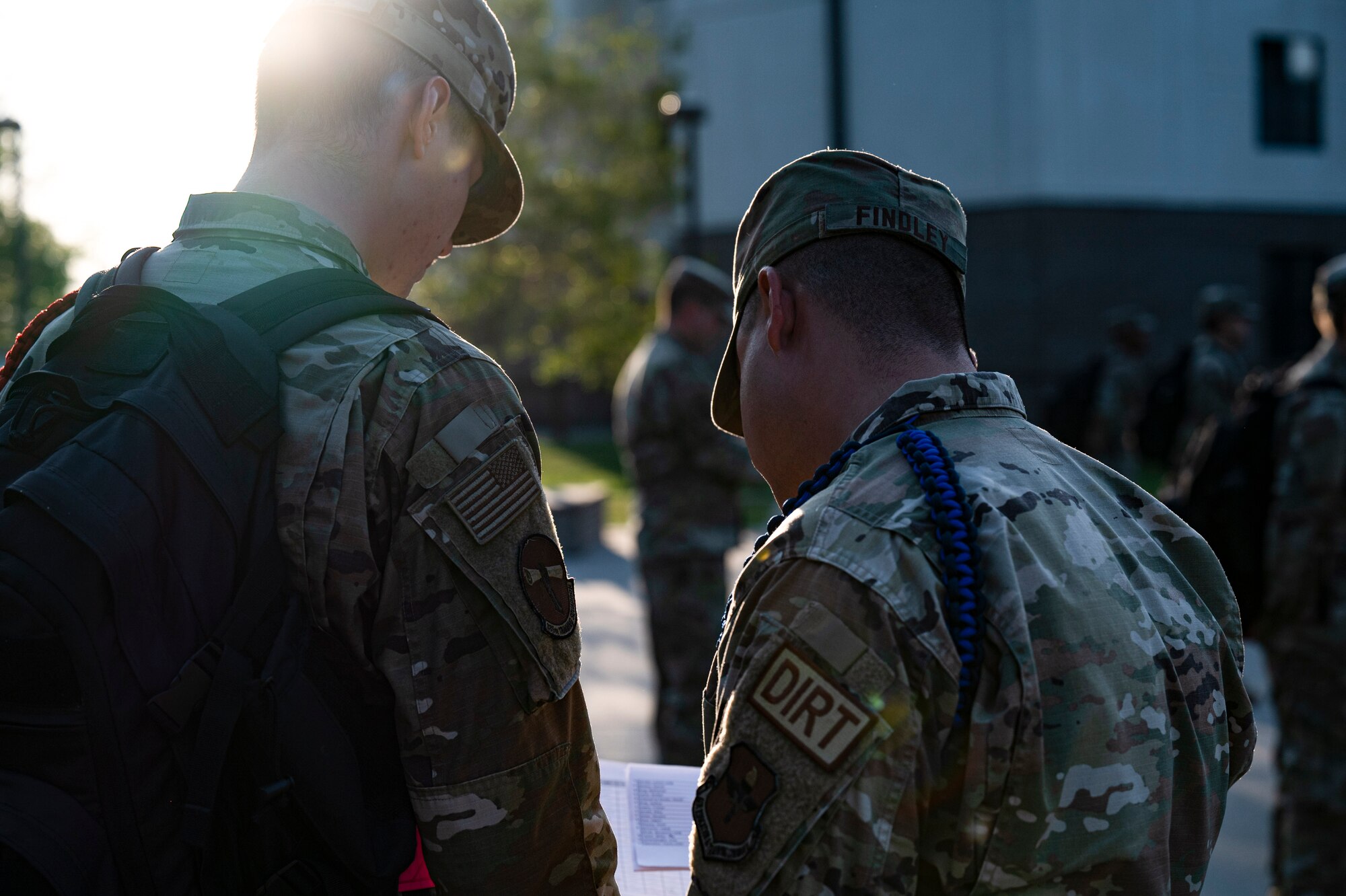 U.S. Air Force Staff Sgt. Austin Findley, 335th Training Squadron master military training leader, assists an Airman in training at Keesler Air Force Base, Mississippi, August 2, 2023. Findley joined the Air Force to travel and be a part of something bigger. (U.S. Air Force photo by Airman 1st Class Trenten Walters)