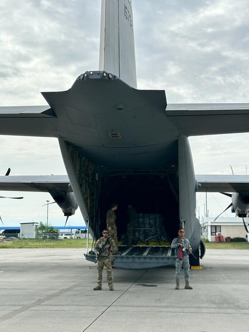 U.S. Air Force Staff Sgt. Emmanuel Nieves (left), an instructor assigned to the 736th Security Forces Squadron, Andersen Air Force Base, Guam, and Philippine Air Force Tech. Sgt. Arwin Mutuc (right), provide rear security as aircrew offload cargo from a C-130 Hercules at General Santos International Airport, Philippines, July 13, 2023. Members of the 736 SFS participated in Cope Thunder 2-23, assisting the PAF with their first fly-away missions to various locations in the Philippines. (Courtesy Photo)