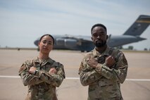Airman 1st Class Lisbeysi Rodriguez 5th Logistics Readiness Squadron traffic management (left), and Airman 1st Class George Francis 5th Logistics Readiness Squadron air transportation function (right), pose for a photo at Minot Air Force Base, North Dakota, Aug. 3, 2023. Teams of highly skilled aircraft maintainers work around the clock to ensure the B-52H Stratofortress can safely and reliably meet mission requirements. (U.S. Air Force photo by Trust Tate)