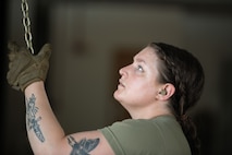 U.S. Air Force Staff Sgt. Janie Maitland, 5th Logistics Readiness Squadron non-commissioned officer in charge of scheduling, opens the dock gate at Minot Air Force Base, North Dakota, Aug. 3, 2023. The 5th LRS mission is to professionally, proactively, and proficiently provide exceptional logistics readiness to assist the MAFB mission. (U.S. Air Force photo by Trust Tate)