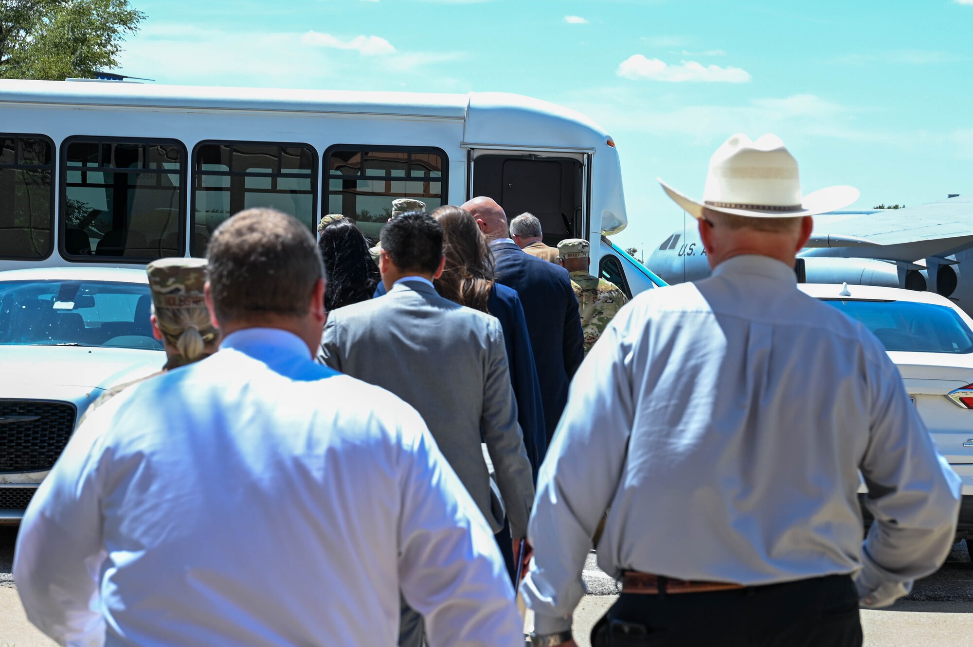 United States Representative Frank Lucas and his team are escorted to a bus by 97th Air Mobility Wing leaders at Altus Air Force Base (AFB), Oklahoma, Aug. 3, 2023. The visit was held to discuss the progress made at Altus AFB since Lucas’ last visit in 2022. (U.S. Air Force photo by Airman 1st Class Heidi Bucins)