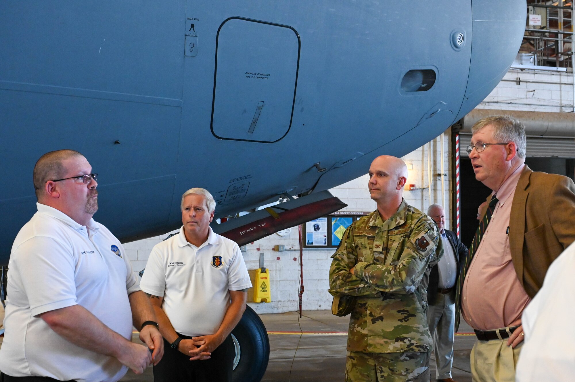 United States Representative Frank Lucas (right) speaks to Jeff Gobeille, 97th Maintenance Squadron Maintenance Flight superintendent (left), at Altus Air Force Base, Oklahoma, Aug. 3, 2023. The group met to discuss KC-46 Pegasus current and projected maintenance and staffing needs. (U.S. Air Force photo by Airman 1st Class Heidi Bucins)