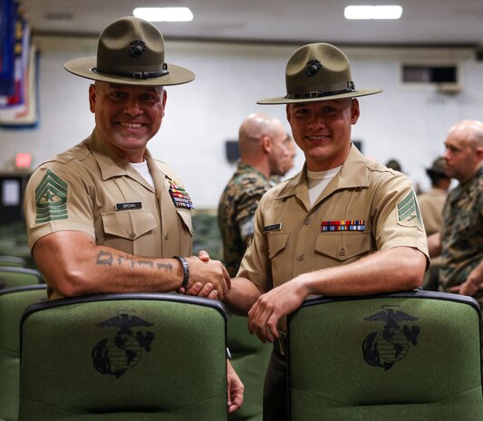 Sgt. Drew Brown, a Drill Instructor with Kilo Company, 3rd Recruit Training Battalion, meets his father Sgt. Maj. Michael Brown after graduating from Drill Instructor School at Marine Corps Recruit Depot Parris Island on June 23, 2023. Sgt. Maj. Brown served his first tour as a Drill Instructor in 2004. Nearly 20 years later, his son Drew, began his journey to become a United States Marine Corps Drill Instructor.
(U.S. Marine Corps photo by Lance Cpl. Michelle Brudnicki)