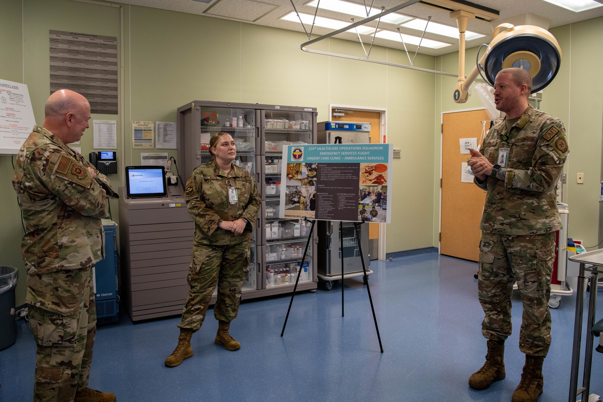 Airmen explaining Urgent Care Center procedures.