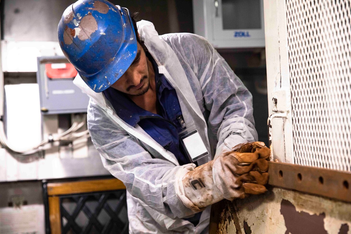 230729-N-LK647-1731 RIJEKA, Croatia (July 29, 2023) Milan Bista, a Rijeka shipyard worker from Nepal, sands a panel on the Ticonderoga-class guided missile cruiser USS Normandy (CG 60) during the ship’s mid-deployment maintenance period in Rijeka, Croatia, July 29, 2023. Normandy is part of the Gerald R. Ford Carrier Strike Group and is on a scheduled deployment in the U.S. Naval Forces Europe area of operations, employed by Sixth Fleet to defend U.S., allied, and partner interests. (U.S. Navy photo by Mass Communication Specialist 2nd Class Malachi Lakey)