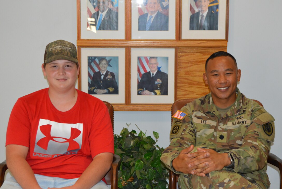 two men sitting in chairs